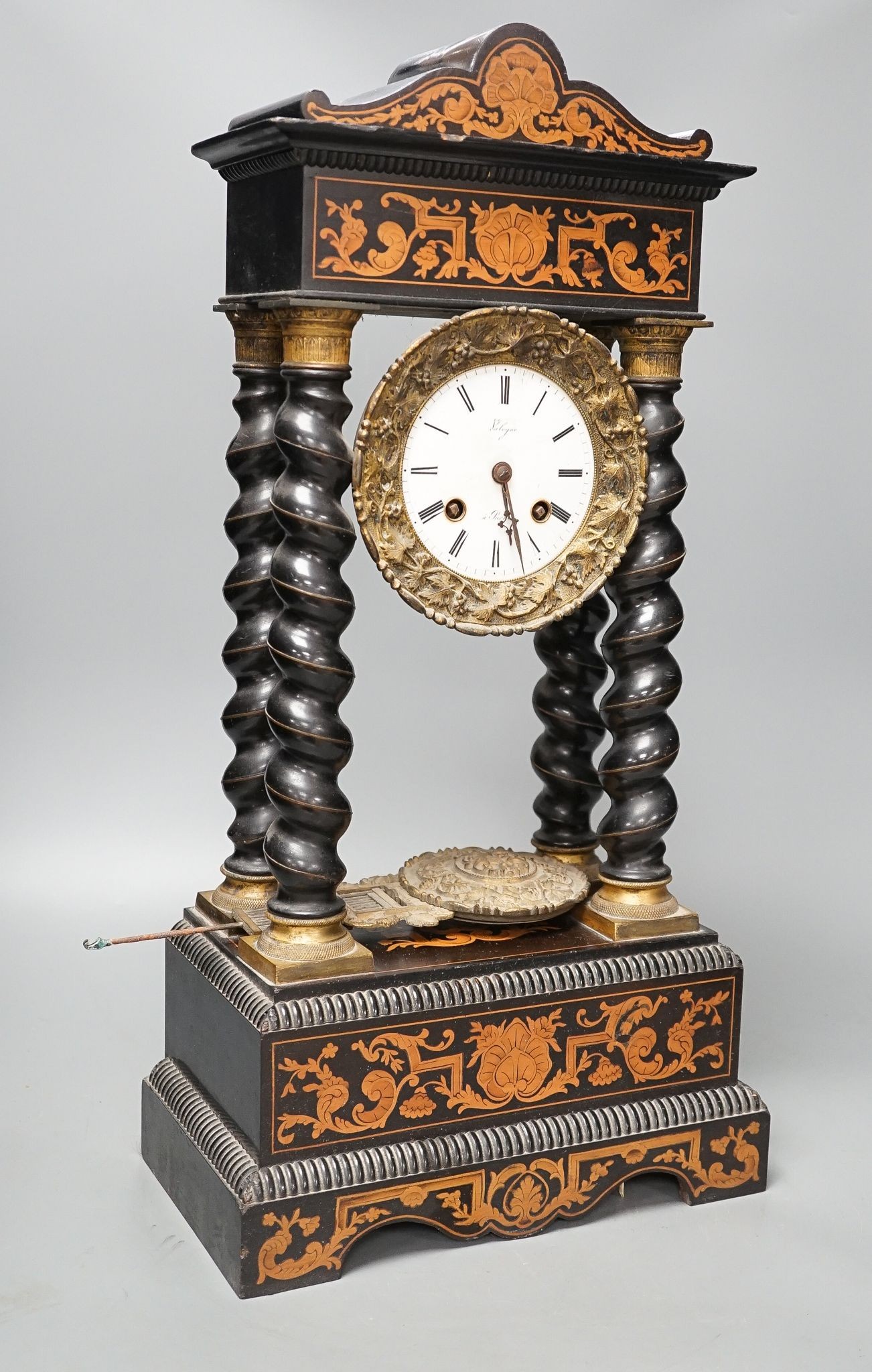 An ebonised and marquetry portico clock, dial signed Valogne, Paris, 56cm high